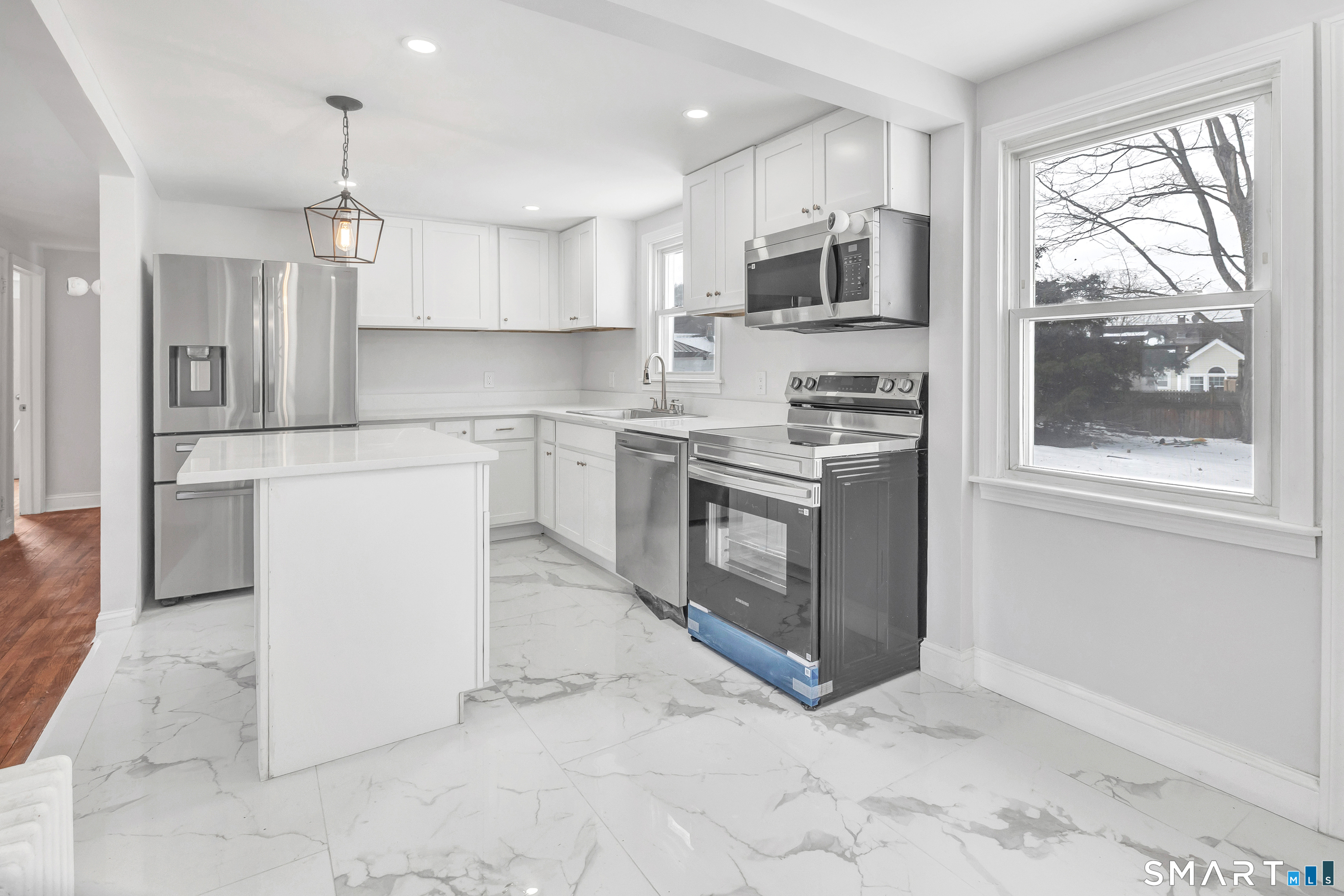 8 River Road East Haven, CT 06512 - Photo 6 of 45 a kitchen with stainless steel appliances granite countertop a stove a sink and a refrigerator