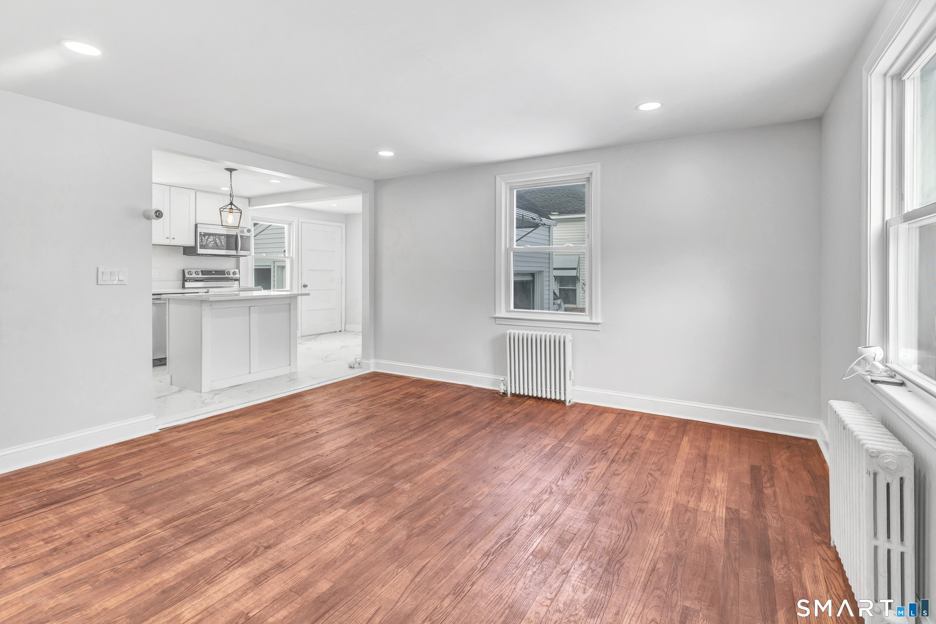 8 River Road East Haven, CT 06512 - Photo 9 of 45 an empty room with wooden floor and windows