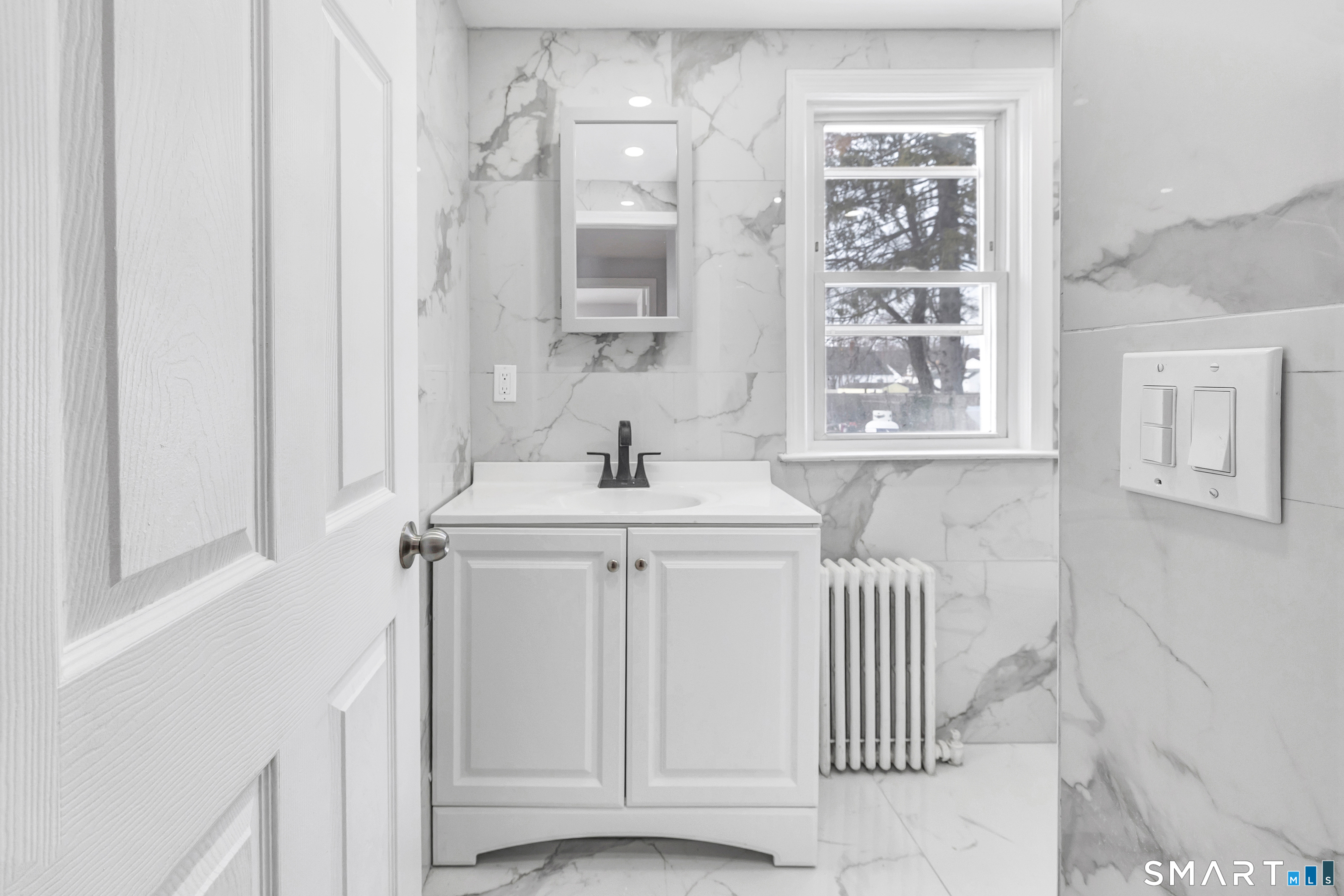 8 River Road East Haven, CT 06512 - Photo 10 of 45 a bathroom with a sink a toilet and a window