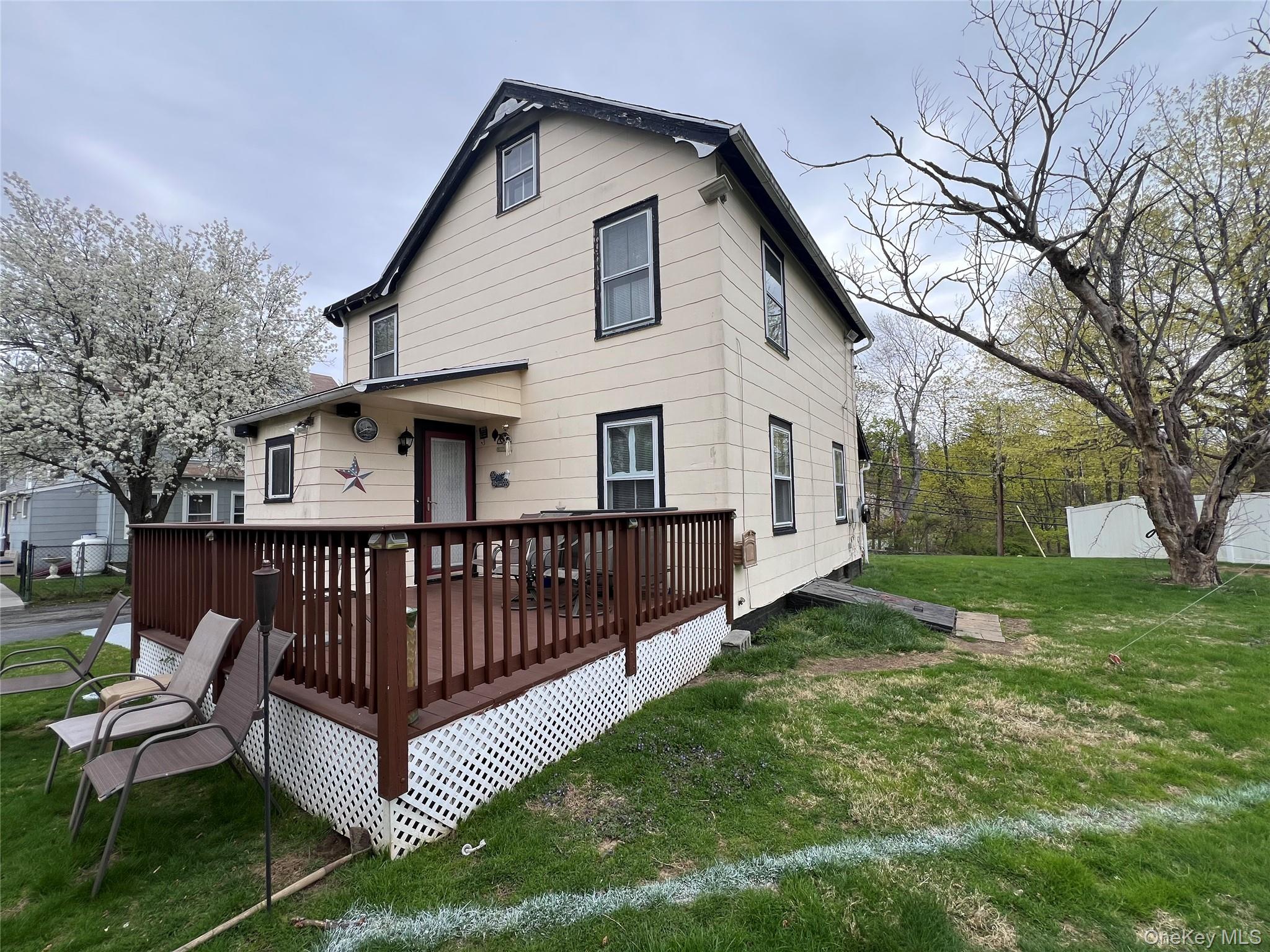 1731 Maple Avenue Peekskill, NY 10566 - Photo 3 of 15 a view of a white house with a big yard and large trees