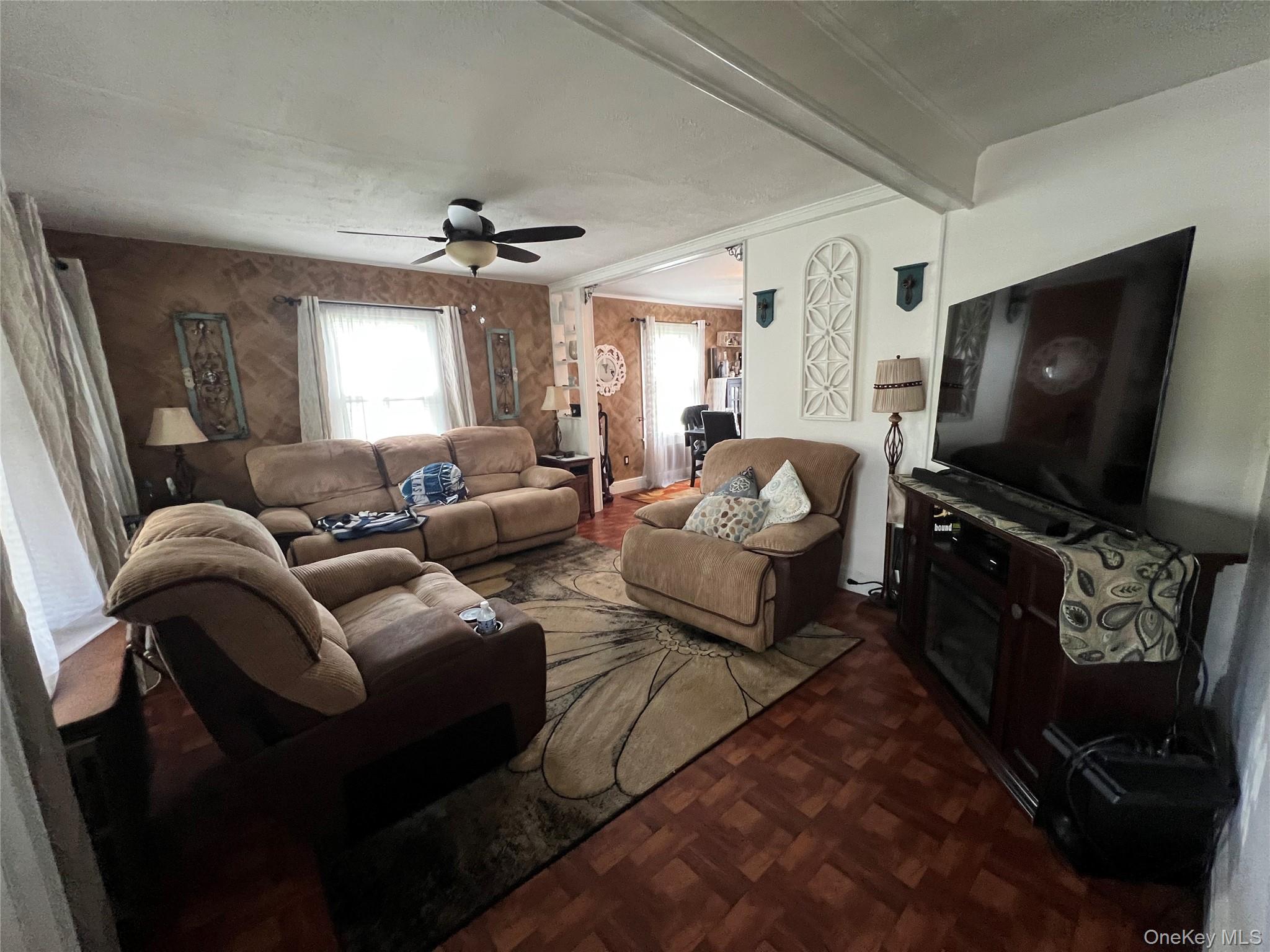 1731 Maple Avenue Peekskill, NY 10566 - Photo 4 of 15 a living room with furniture and a flat screen tv