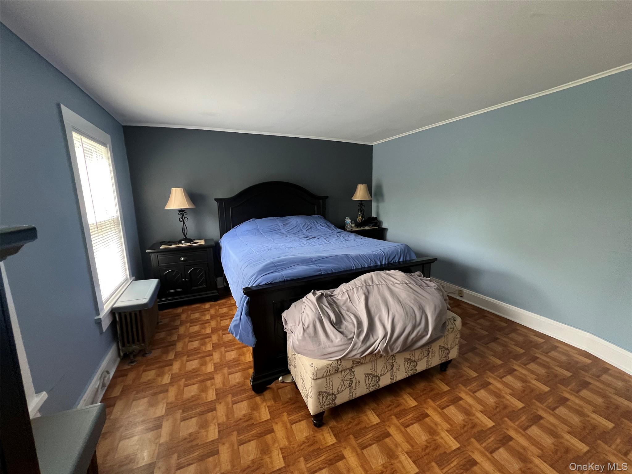 1731 Maple Avenue Peekskill, NY 10566 - Photo 9 of 15 a bedroom with a bed and wooden floor