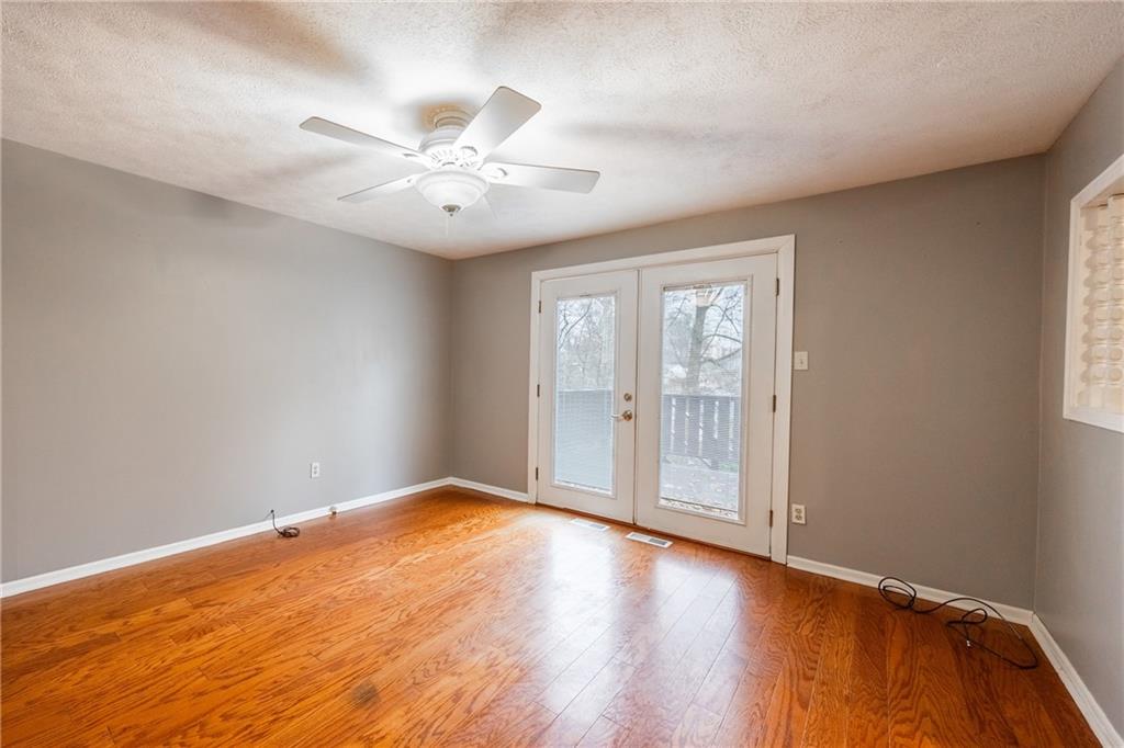 1069 Highfield Road Bethel Park, PA 15102 - Photo 14 of 41 an empty room with wooden floor fan and windows