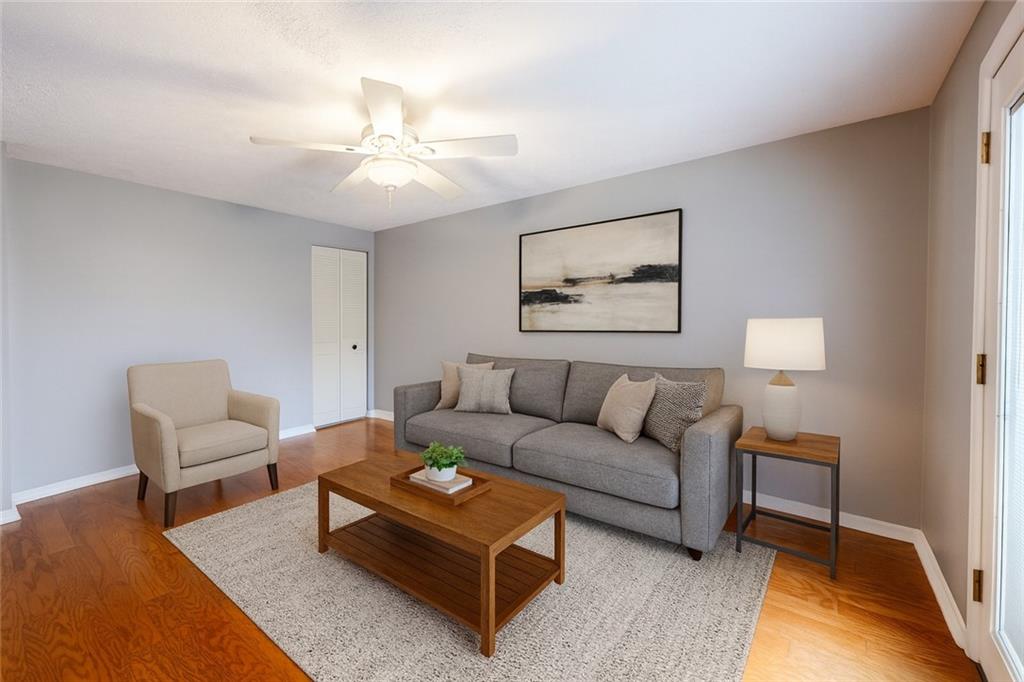 1069 Highfield Road Bethel Park, PA 15102 - Photo 16 of 41 a living room with furniture and a rug