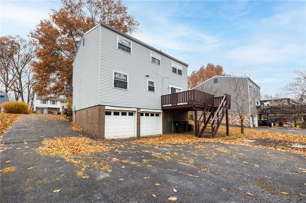 1069 Highfield Road Bethel Park, PA 15102 - Photo 31 of 41 a front view of a house with a yard