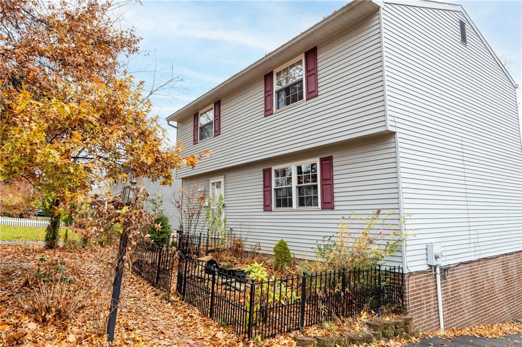 1069 Highfield Road Bethel Park, PA 15102 - Photo 35 of 41 a view of a house with a yard