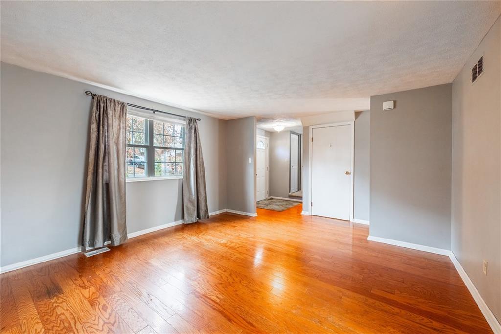 1069 Highfield Road Bethel Park, PA 15102 - Photo 5 of 41 a view of empty room with wooden floor