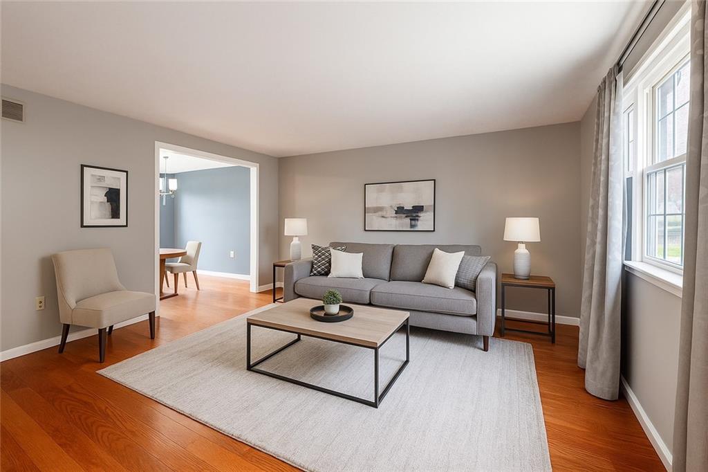 1069 Highfield Road Bethel Park, PA 15102 - Photo 6 of 41 a living room with furniture a lamp and a window