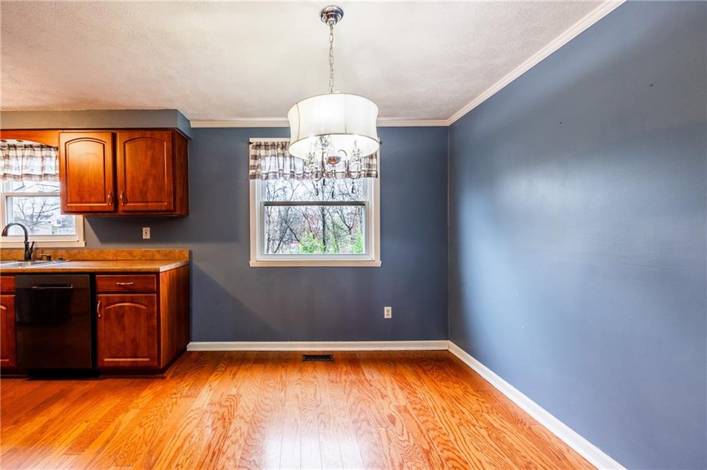 1069 Highfield Road Bethel Park, PA 15102 - Photo 9 of 41 a view of kitchen with granite countertop cabinets and window