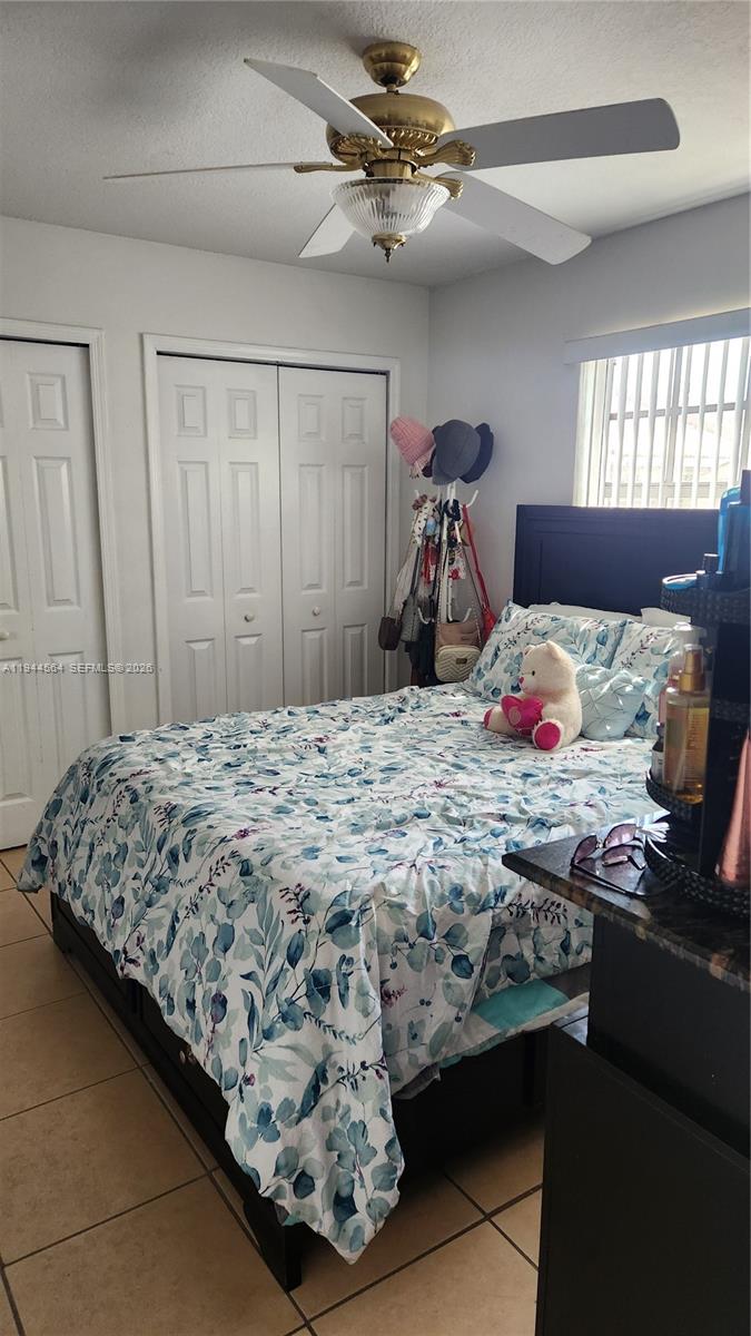 8254 Southwest 147th Place Miami, FL 33193 - Photo 12 of 14 a bedroom with bed and window