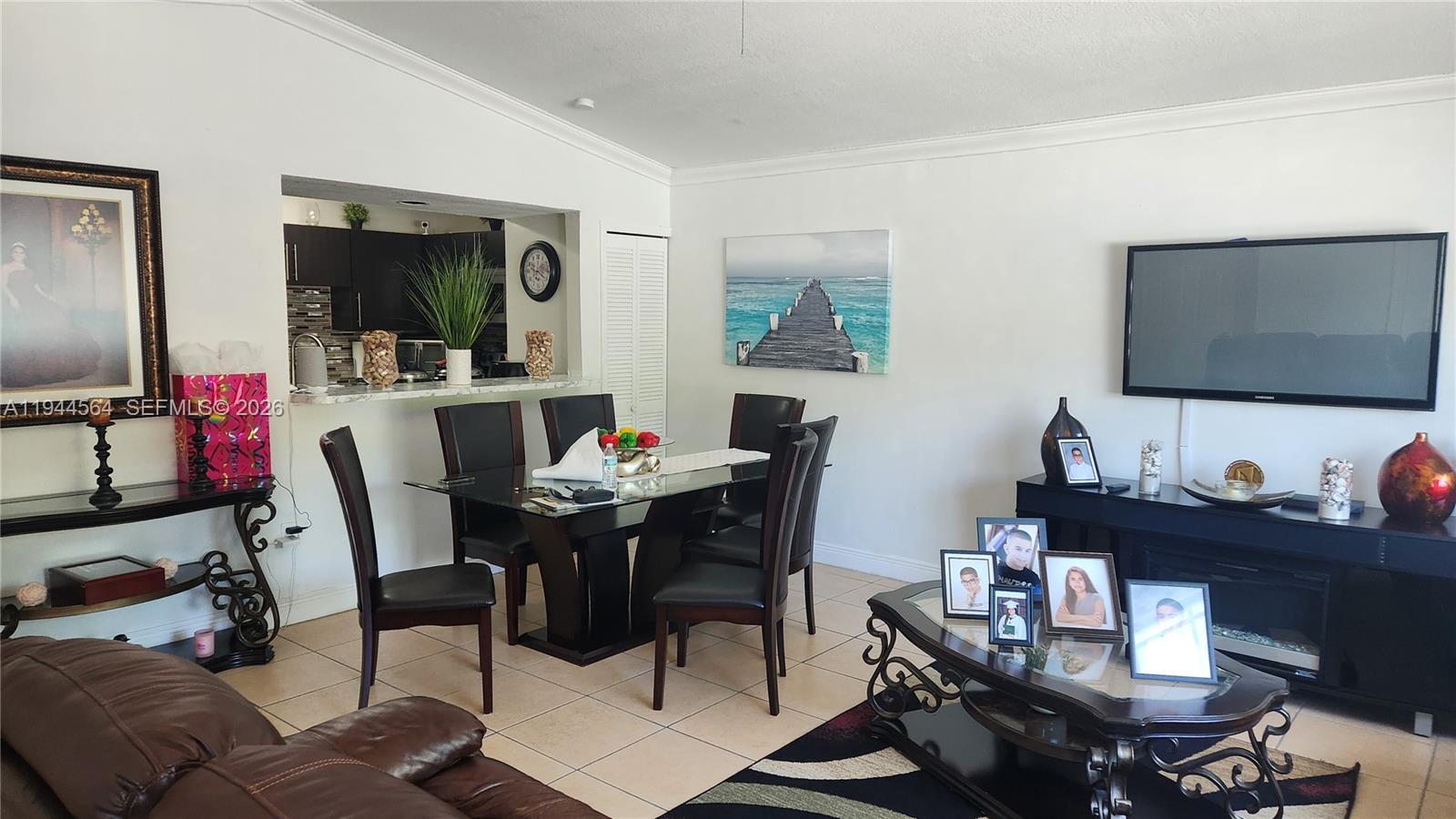 8254 Southwest 147th Place Miami, FL 33193 - Photo 7 of 14 a living room with furniture and a flat screen tv