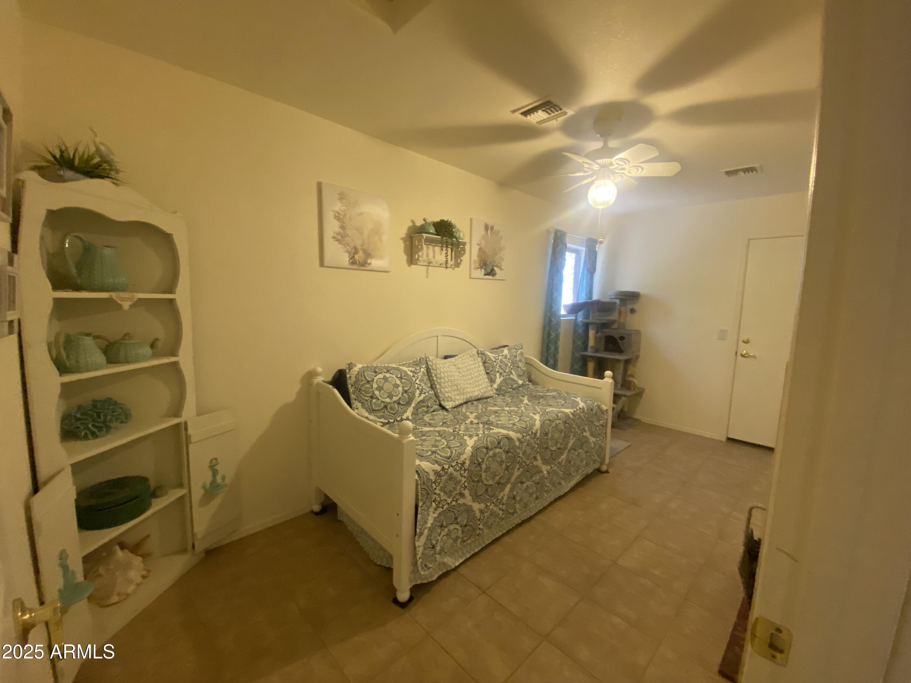 2101 South Meridian Road, Unit 431 Apache Junction, AZ 85120 - Photo 11 of 26 a spacious bedroom with a bed and a cabinets
