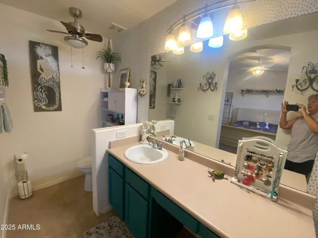 a bathroom with a sink double vanity and a mirror