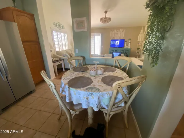 a view of a dining room with furniture and window
