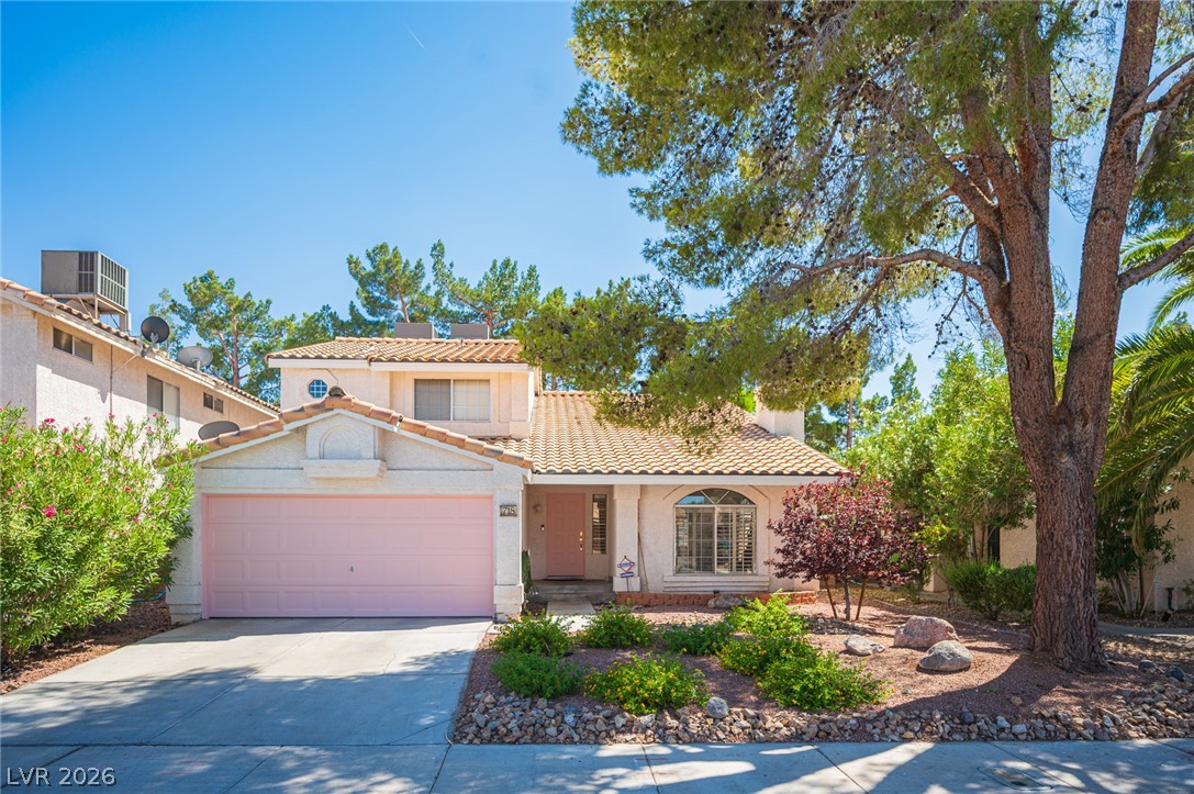 718 Rusty Spur Drive Henderson, NV 89014 - Photo 1 of 50 A well-maintained facade with mature landscaping provides charming curb appeal.