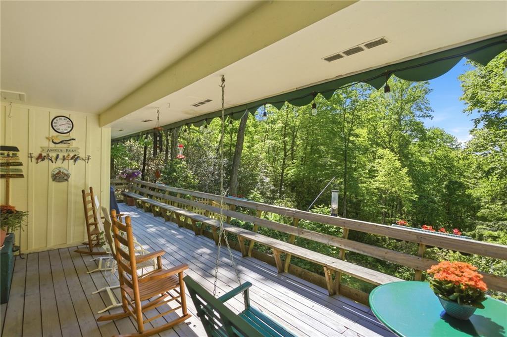 46 Spartan Lane Rabun Gap, GA 30568 - Photo 58 of 89 a view of a balcony with wooden floor and outdoor space