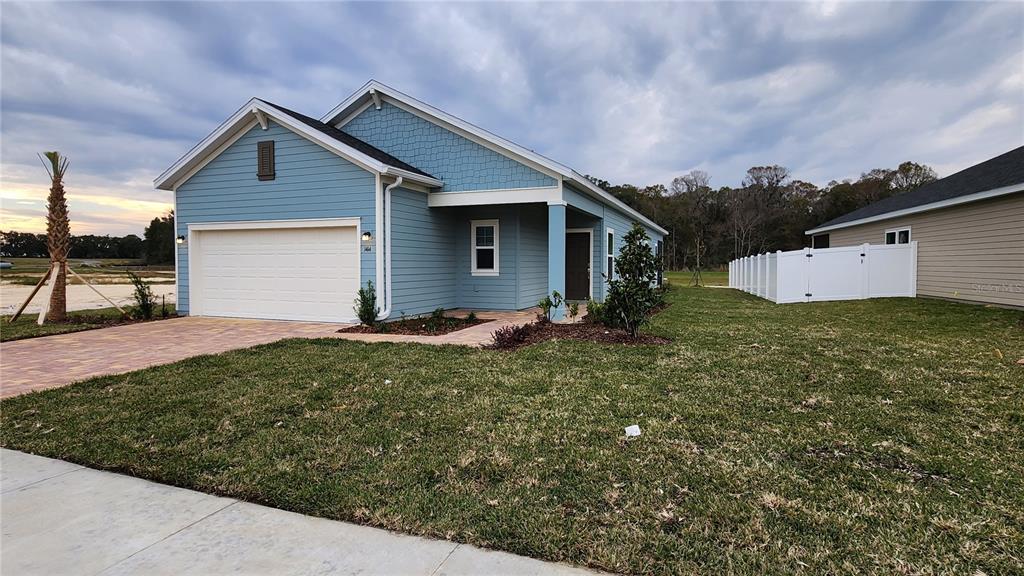 Landscaped, fully sodded, and driveway/walk with pavers