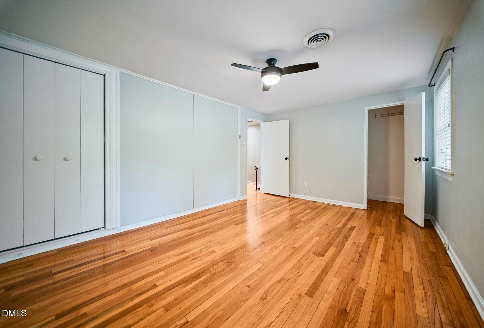 967 St Marys Street Raleigh, NC 27605 - Photo 26 of 34 a view of empty room with wooden floor and fan