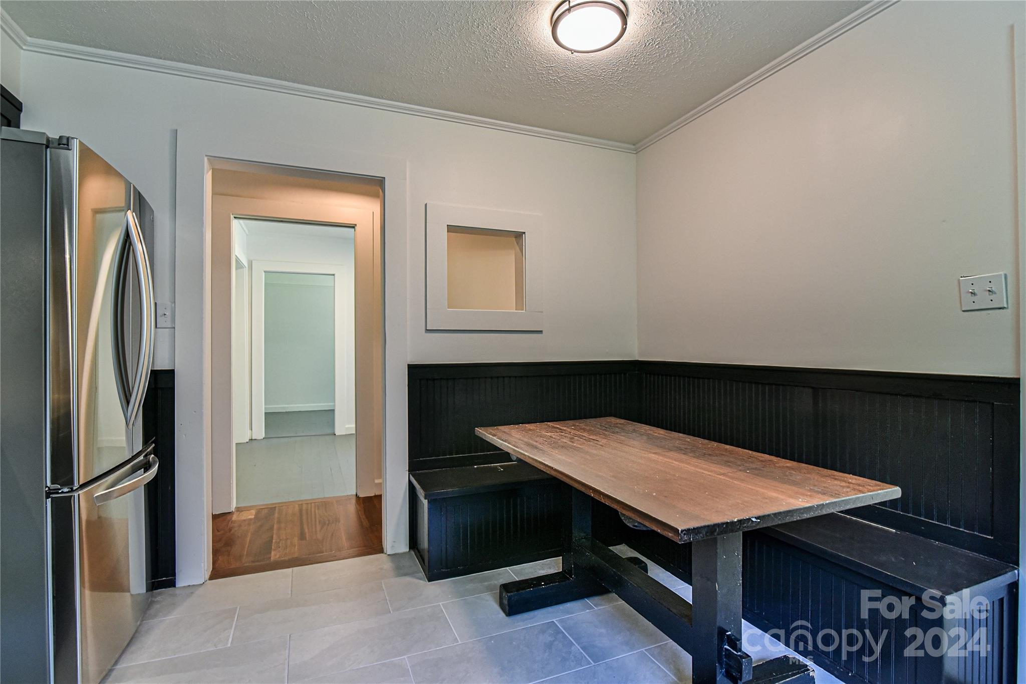 210 East Oakview Road Asheville, NC 28806 - Photo 11 of 31 a room with a table and chairs