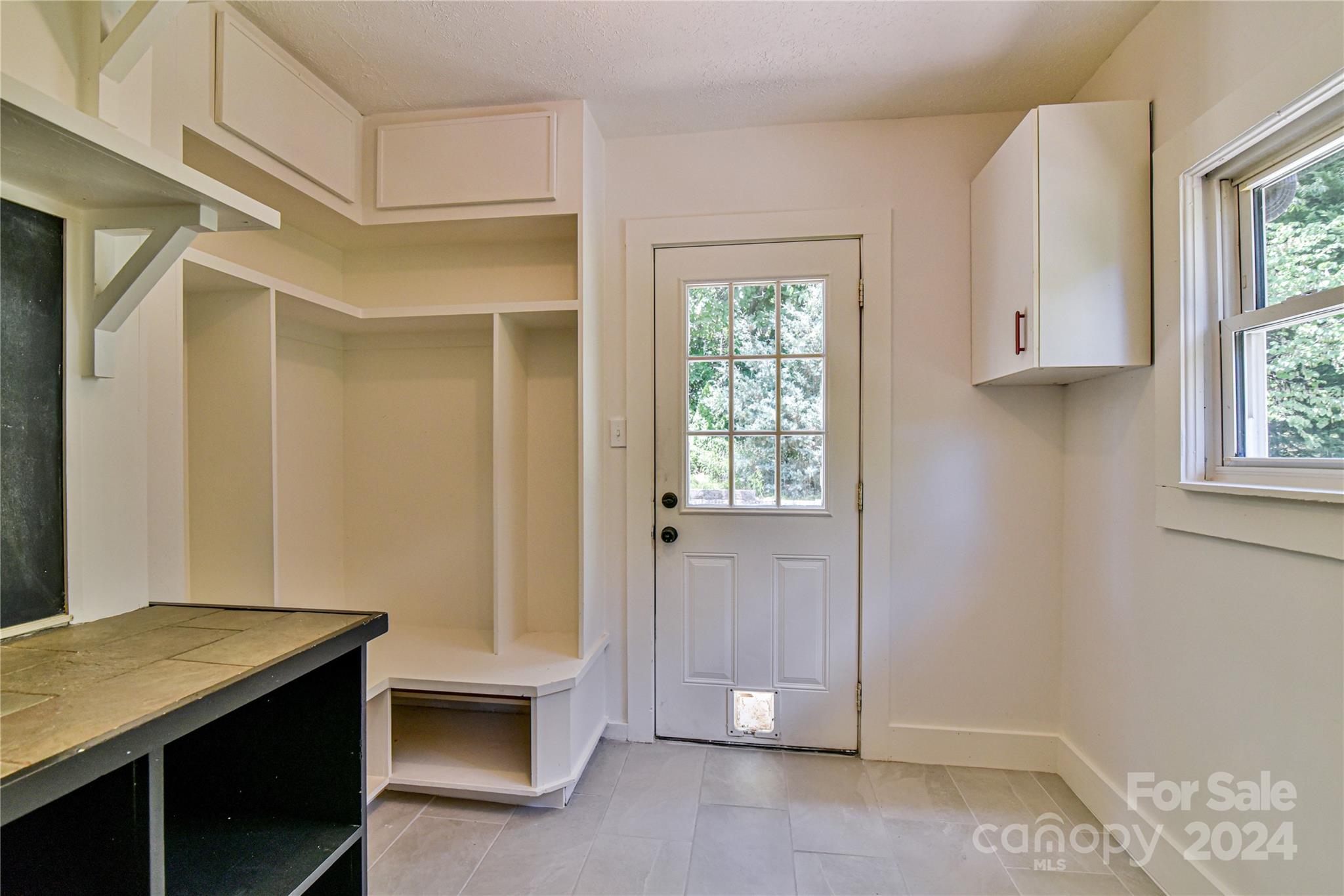 210 East Oakview Road Asheville, NC 28806 - Photo 12 of 31 a view of room with window and hallway