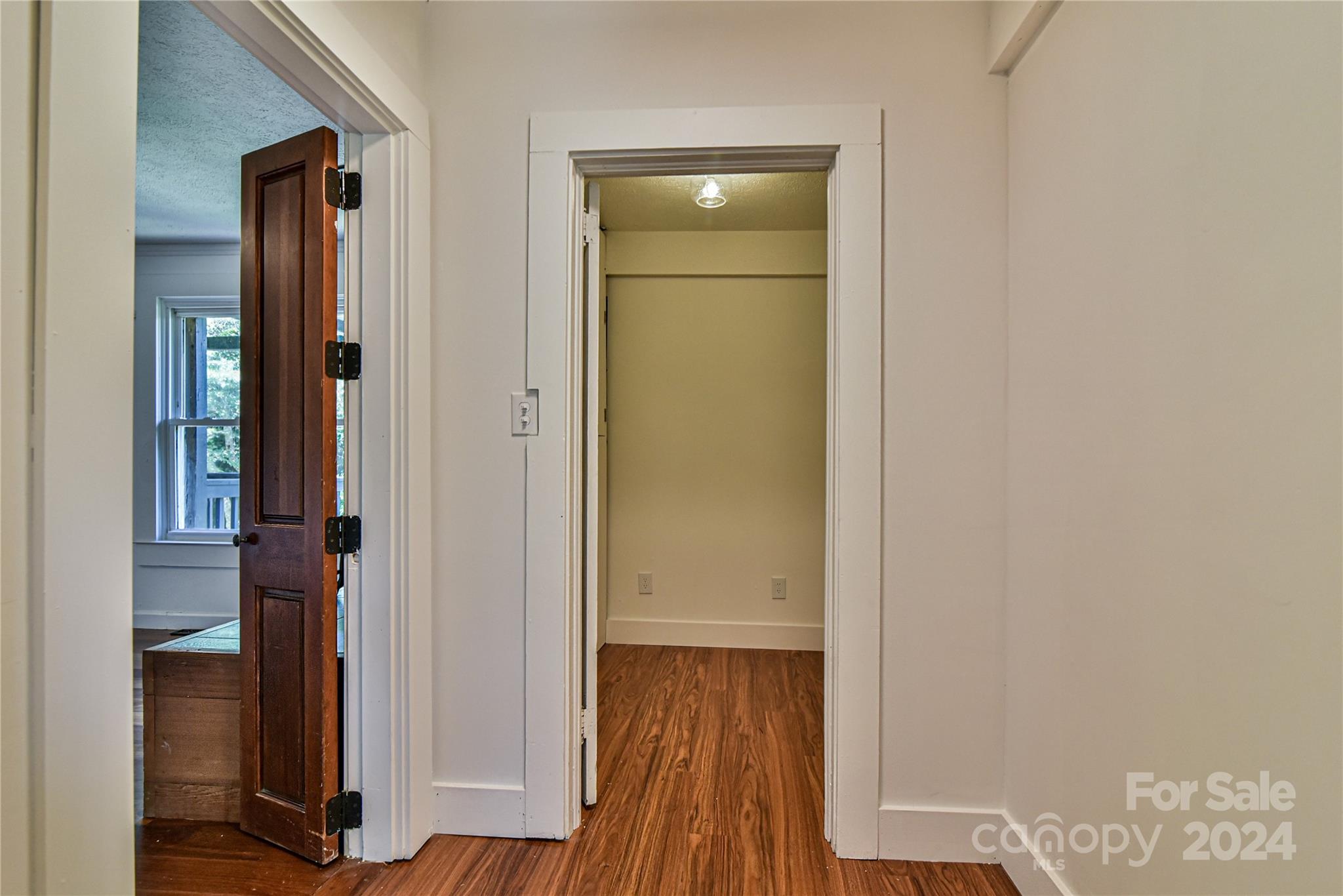 210 East Oakview Road Asheville, NC 28806 - Photo 13 of 31 a view of a hallway with wooden floor and closet