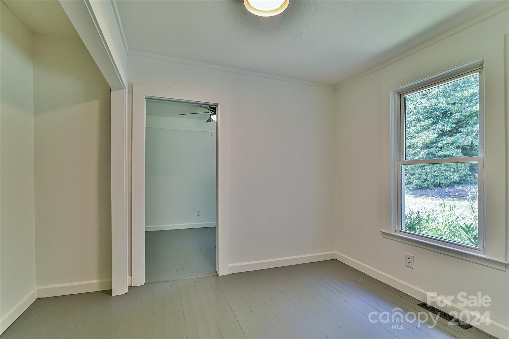 210 East Oakview Road Asheville, NC 28806 - Photo 18 of 31 an empty room with windows