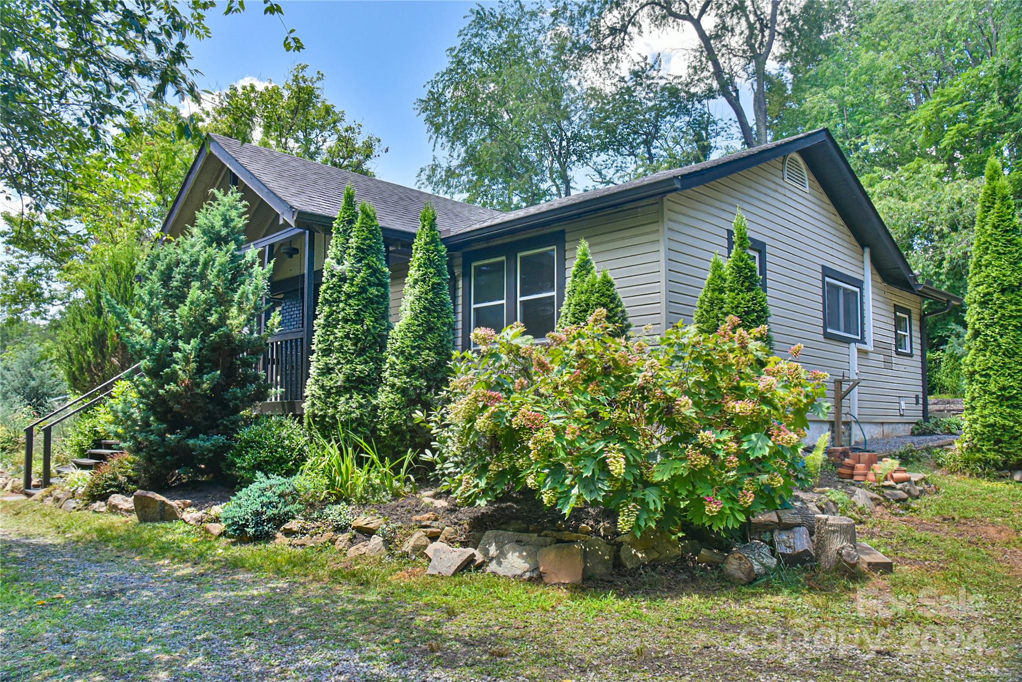 210 East Oakview Road Asheville, NC 28806 - Photo 2 of 31 a view of a house with a yard and potted plants