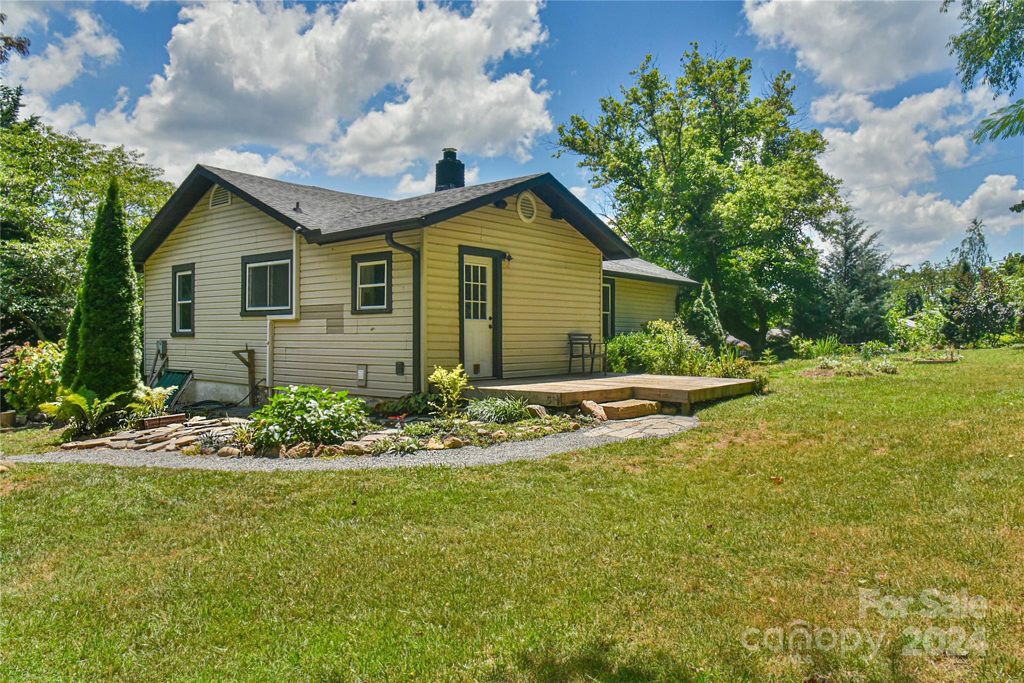 210 East Oakview Road Asheville, NC 28806 - Photo 22 of 31 a view of house with yard and trees in the background