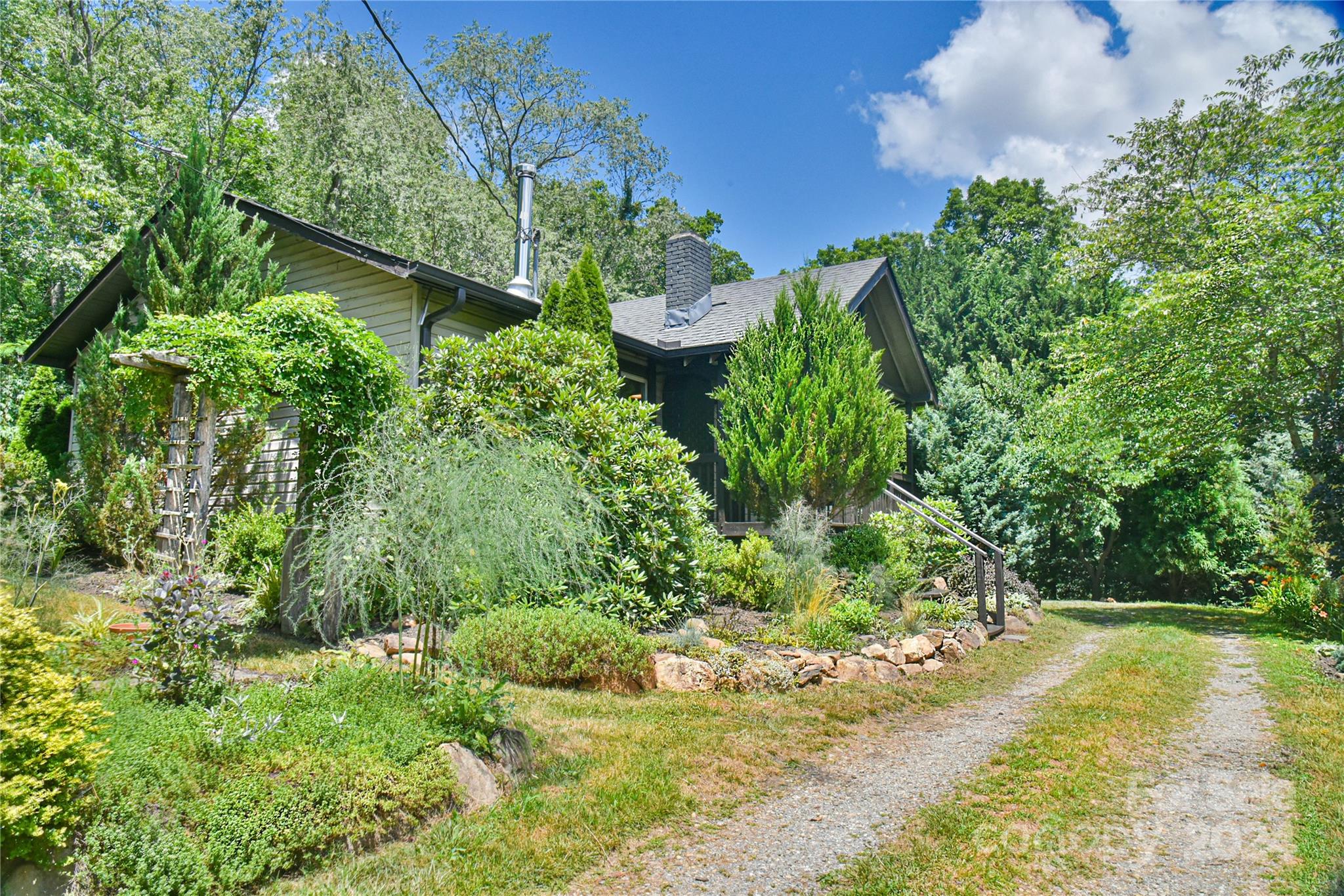 210 East Oakview Road Asheville, NC 28806 - Photo 25 of 31 a view of a garden with large trees