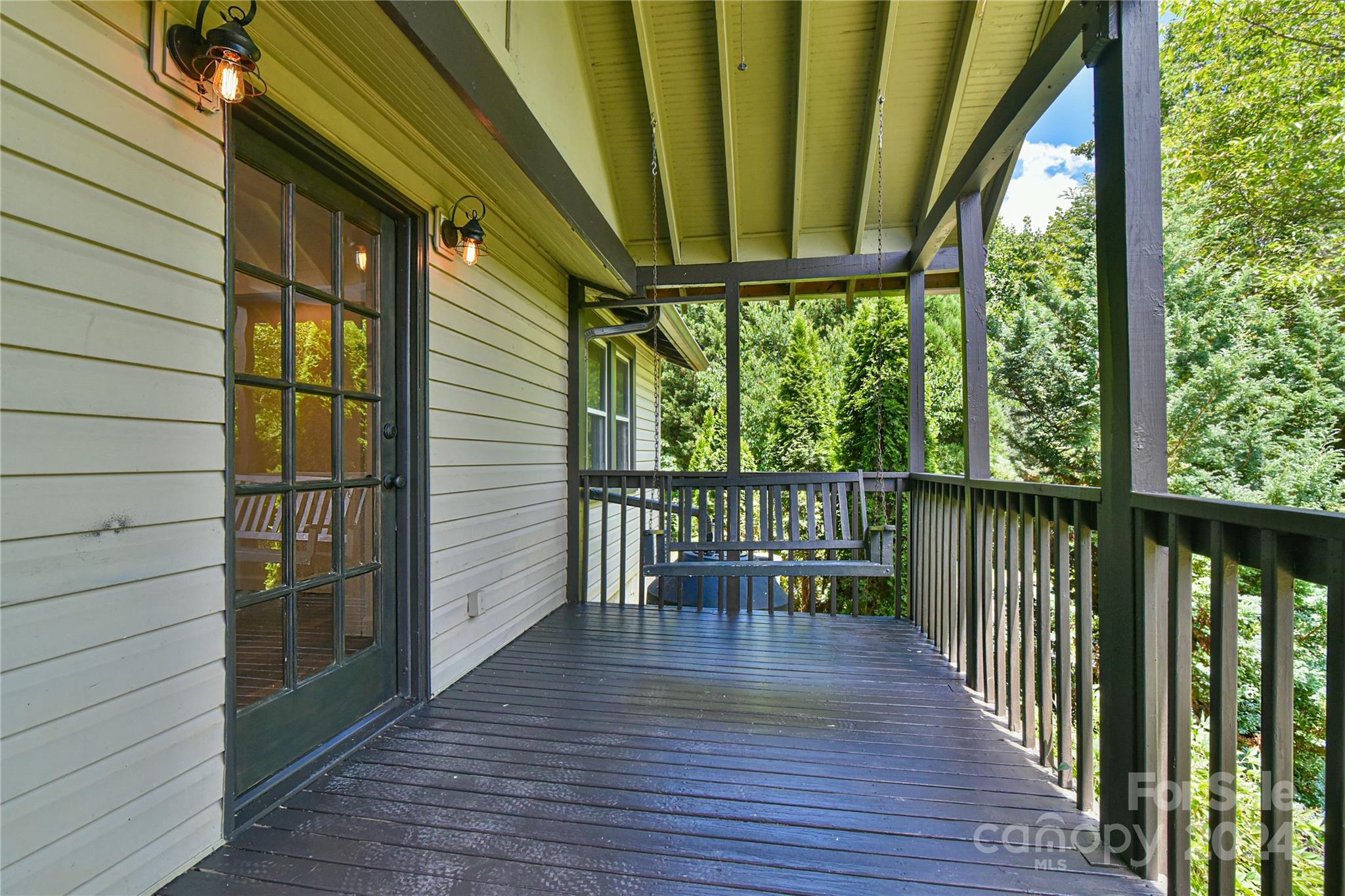 210 East Oakview Road Asheville, NC 28806 - Photo 3 of 31 a view of a chairs on the deck