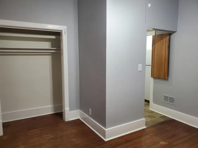 a view of an entryway door with wooden floor