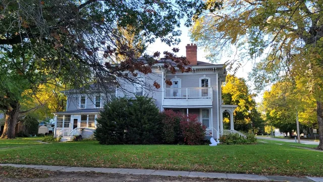 a view of house with yard