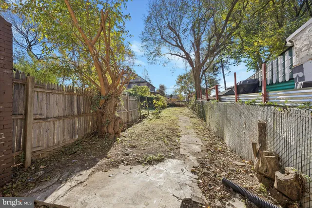 a view of a yard covered with snow