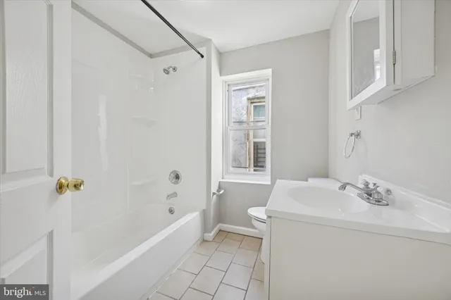 a bathroom with a sink a vanity and shower