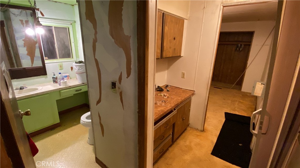 17698 Walker Mine Road Redding, CA 96003 - Photo 14 of 29 a room with cabinets and a fireplace