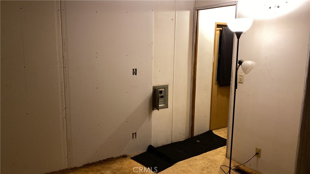 17698 Walker Mine Road Redding, CA 96003 - Photo 18 of 29 a view of a hallway with wooden floor and staircase
