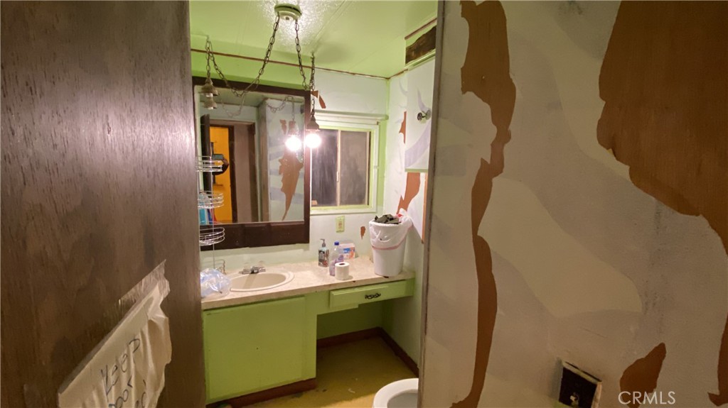 17698 Walker Mine Road Redding, CA 96003 - Photo 20 of 29 a bathroom with a sink vanity and a mirror