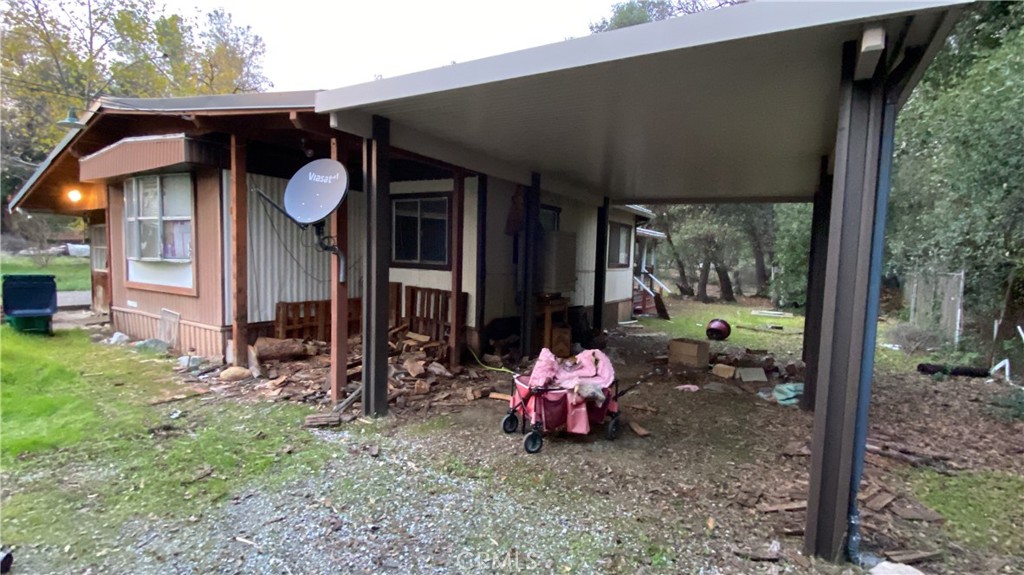 17698 Walker Mine Road Redding, CA 96003 - Photo 2 of 29 a view of a chair and table in backyard of the house