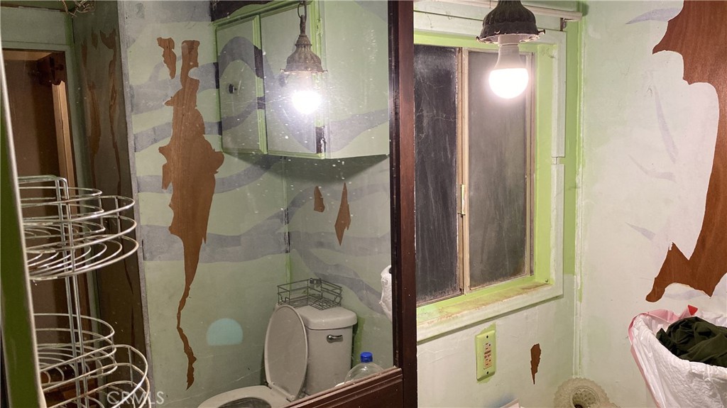 17698 Walker Mine Road Redding, CA 96003 - Photo 25 of 29 a bathroom with a mirror and a shower