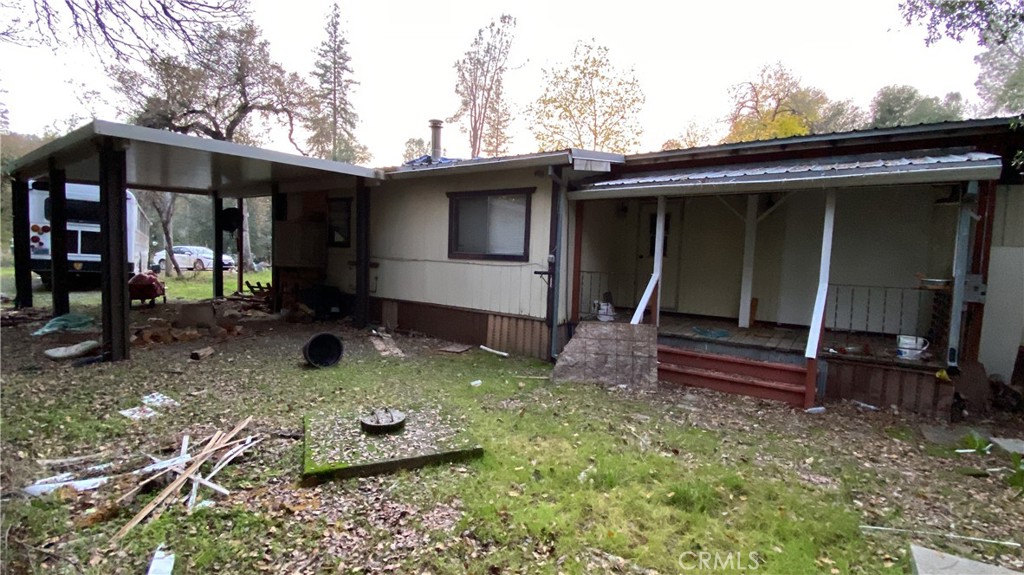 17698 Walker Mine Road Redding, CA 96003 - Photo 4 of 29 a backyard of house with swing and slide