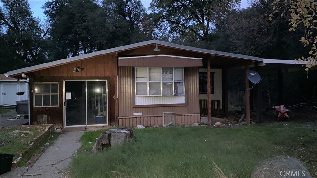 17698 Walker Mine Road Redding, CA 96003 - Photo 8 of 29 a front view of a house with garden
