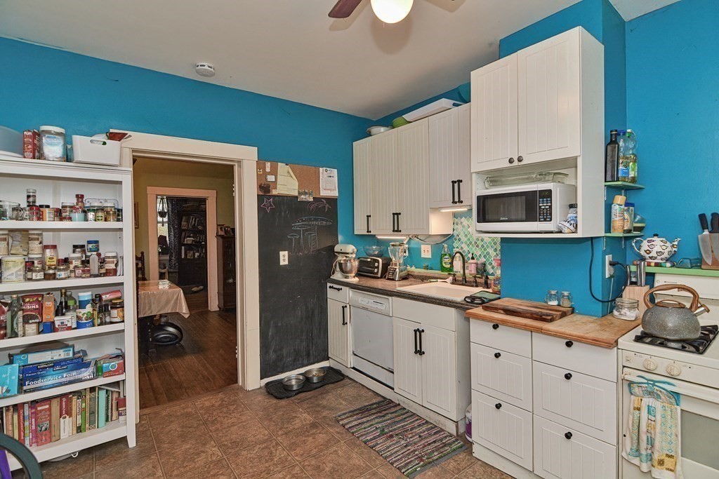 183 Main Street Northampton, MA 01053 - Photo 11 of 42 a kitchen with cabinets and window