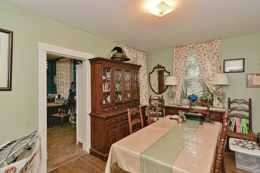 183 Main Street Northampton, MA 01053 - Photo 12 of 42 a bed room with a bed and a mirror