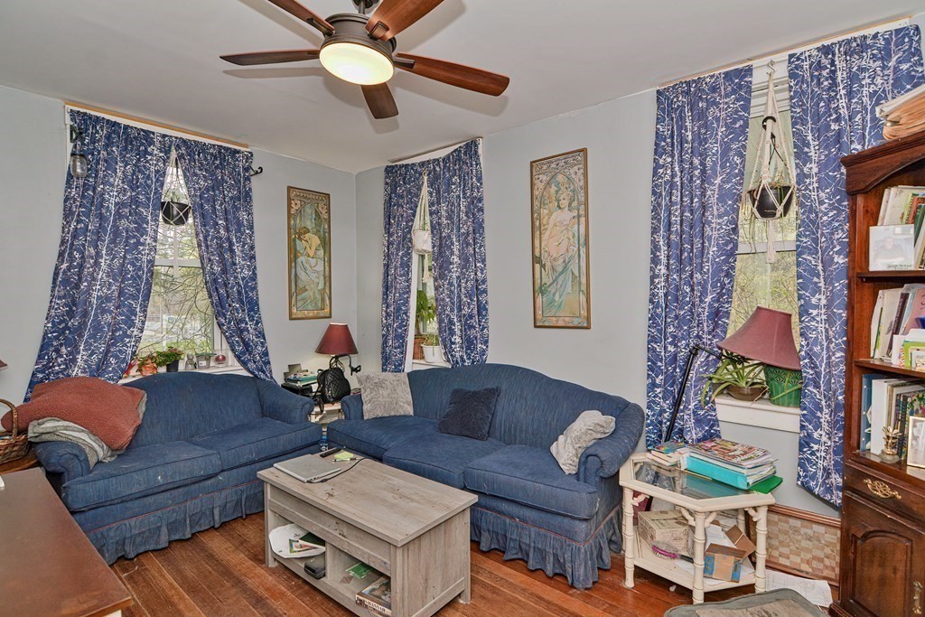 183 Main Street Northampton, MA 01053 - Photo 14 of 42 a living room with furniture and a large window