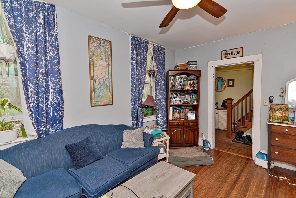 183 Main Street Northampton, MA 01053 - Photo 15 of 42 a living room with furniture and a bookshelf