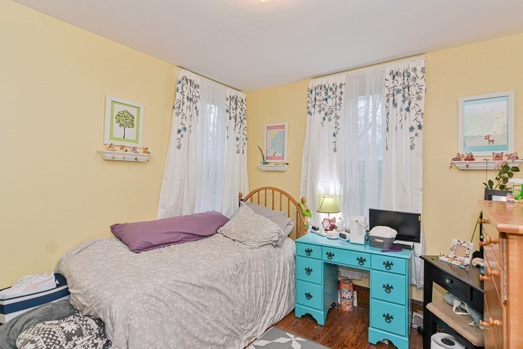 183 Main Street Northampton, MA 01053 - Photo 17 of 42 a bedroom with a bed and a window
