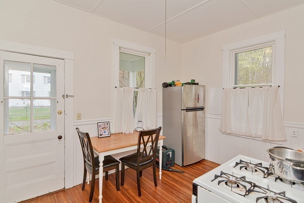 183 Main Street Northampton, MA 01053 - Photo 18 of 42 a view of a dining room with furniture and a window