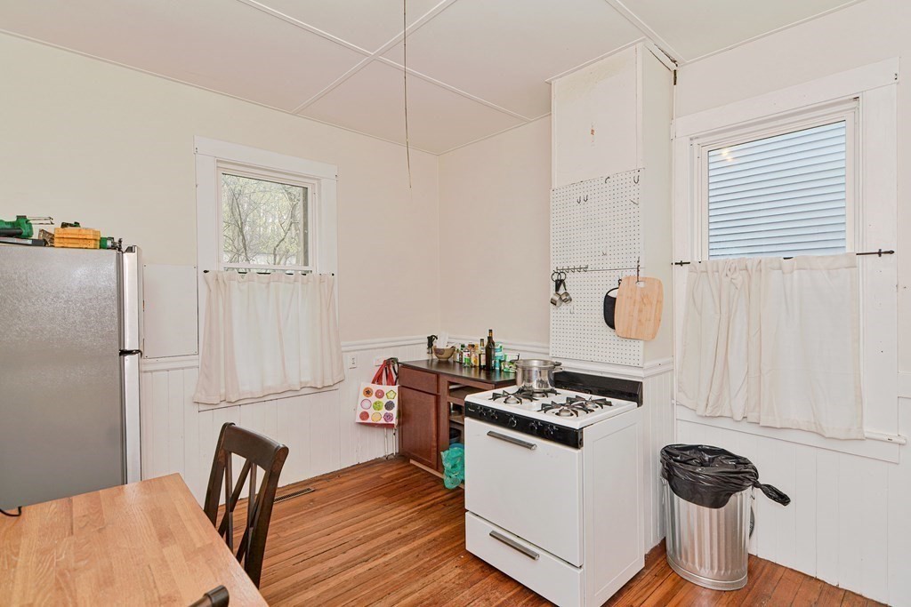 183 Main Street Northampton, MA 01053 - Photo 19 of 42 a kitchen with stainless steel appliances granite countertop a stove and a refrigerator