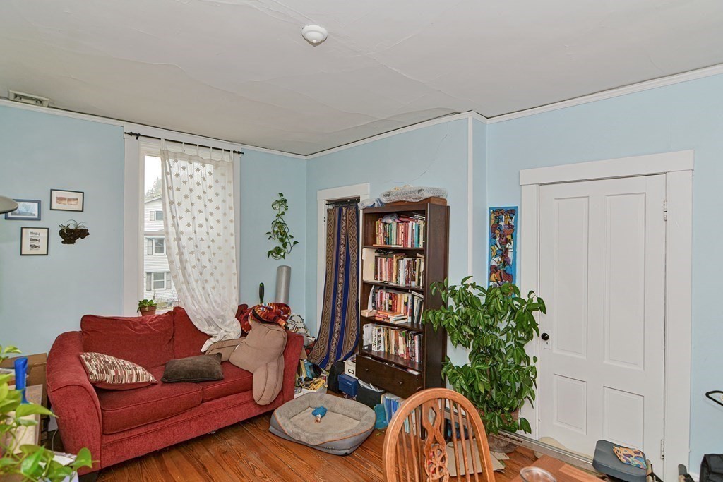 183 Main Street Northampton, MA 01053 - Photo 25 of 42 a living room with furniture potted plant and a window