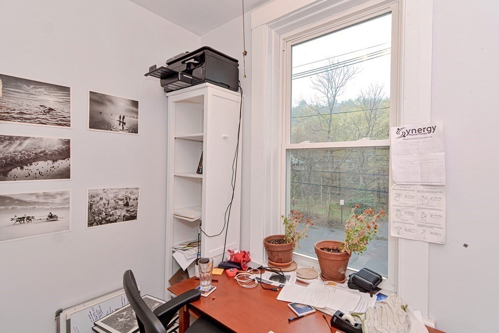 183 Main Street Northampton, MA 01053 - Photo 28 of 42 a view of a workspace with furniture and a window